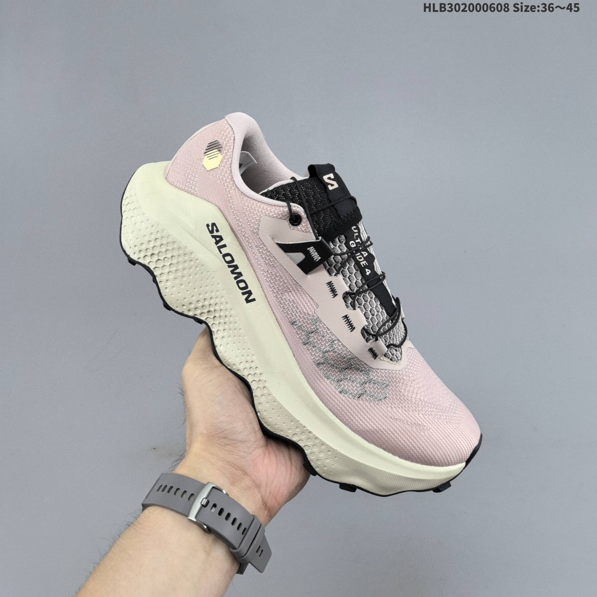 Salomon Ultra Glide 4 Trail Running Shoes, in Pink and Cream - product image from the listing.