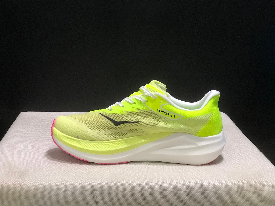 HOKA Rocket X 3 Running Shoes in Neon in Yellow and Pink - product image from the listing.
