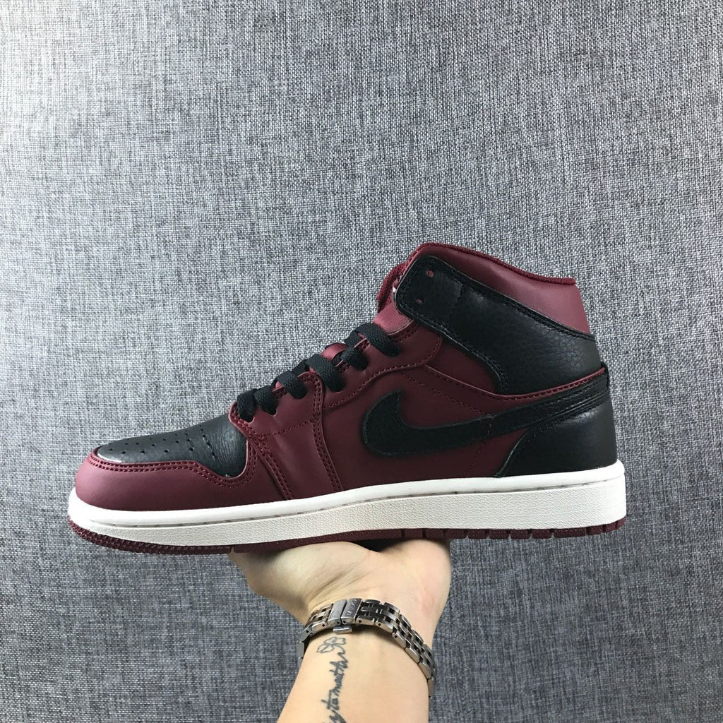 Air Jordan 1 Mid High-Top Sneakers in Burgundy and Black - product image from the listing.