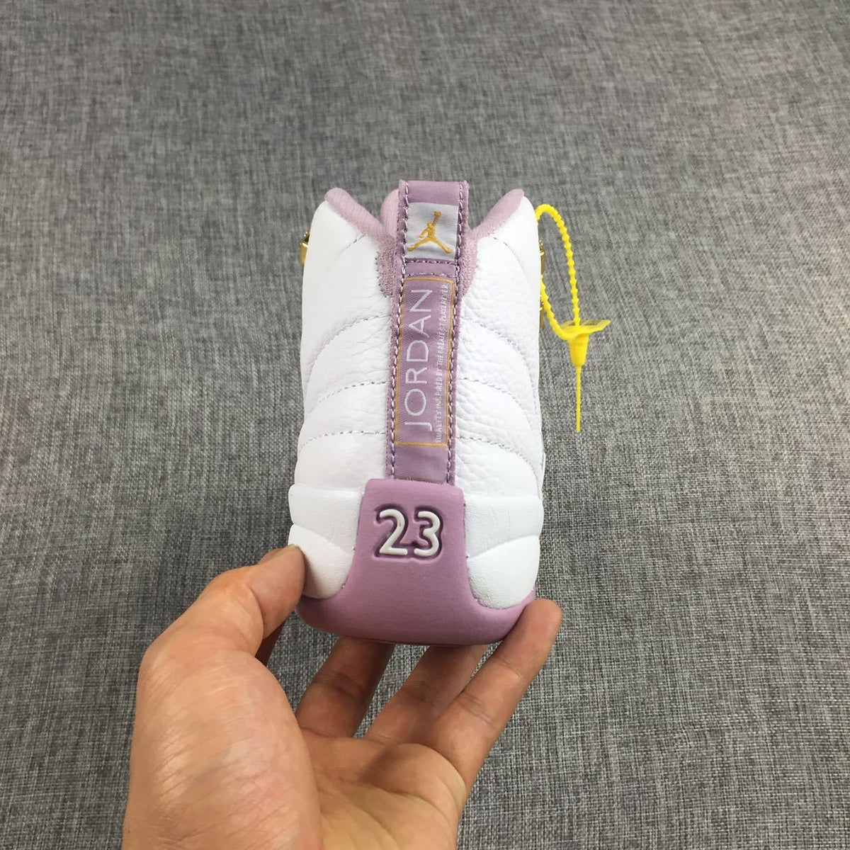 Air Jordan 12 Cherry Blossom Pink Sneakers - product image from the listing.