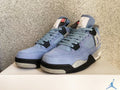 Jordan 4 Retro Sneakers in University Blue - product image from the listing.