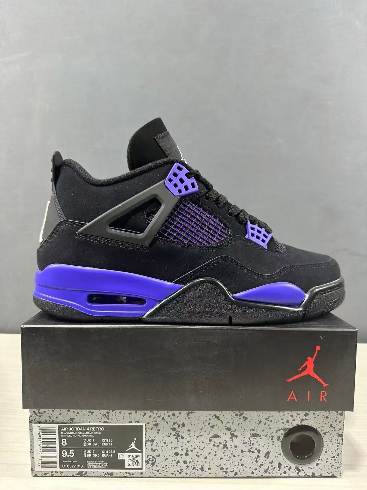 Air Jordan 4 Retro Black Blue Sneakers CT8527-018 - product image from the listing.