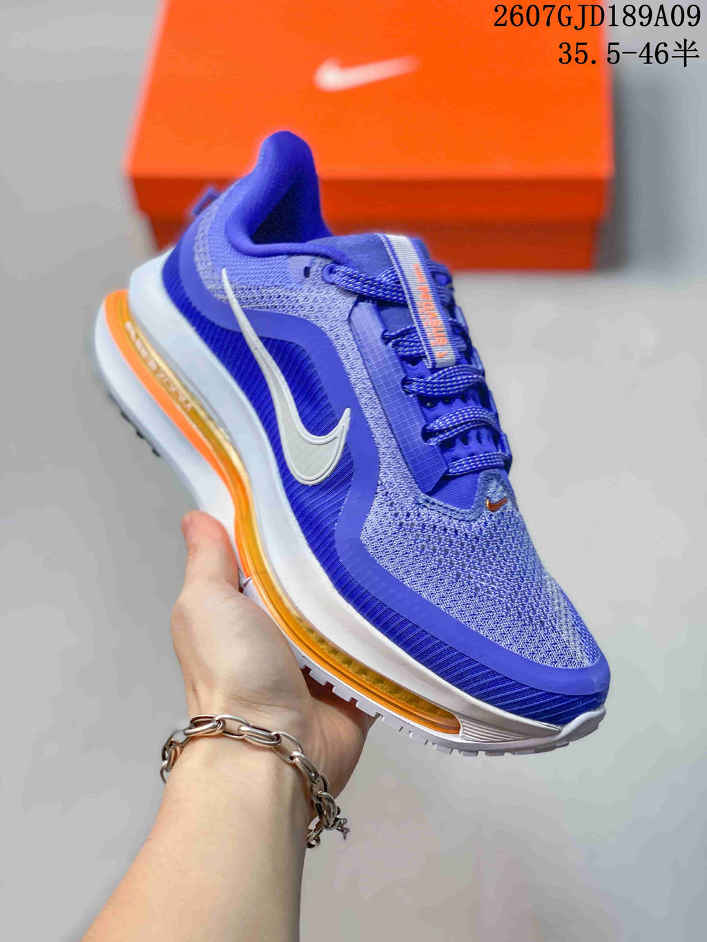 Nike Vomero Premium Running Shoes in Blue - product image from the listing.