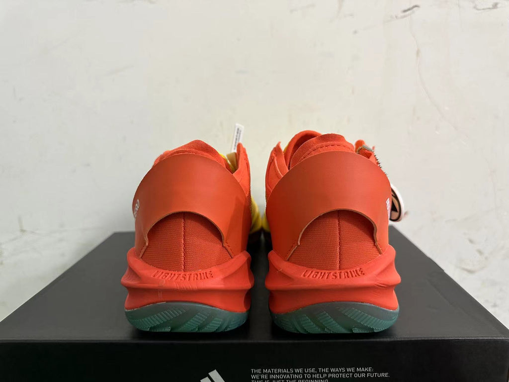 Adidas Adizero Basketball Shoes in Yellow Orange - product image from the listing.