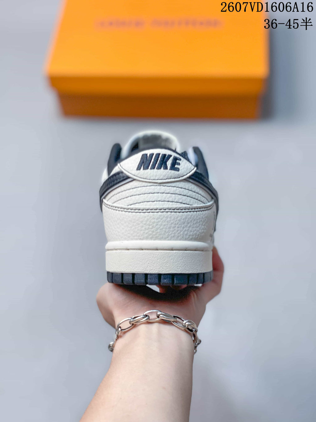 Nike SB Dunk Low LV Monogram Sneakers in White and Navy - product image from the listing.