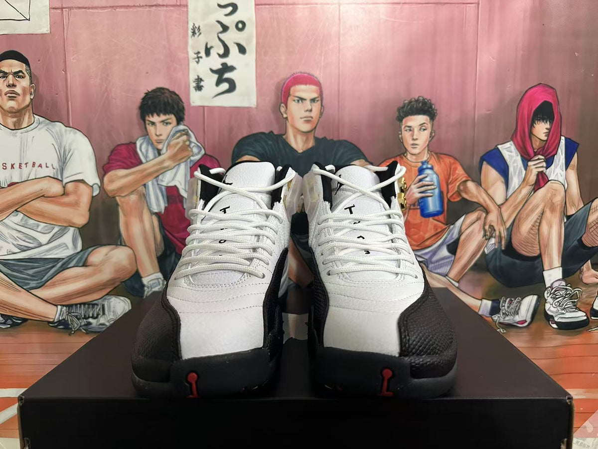 Jordan 12 Taxi Sneakers in White and Black - product image from the listing.