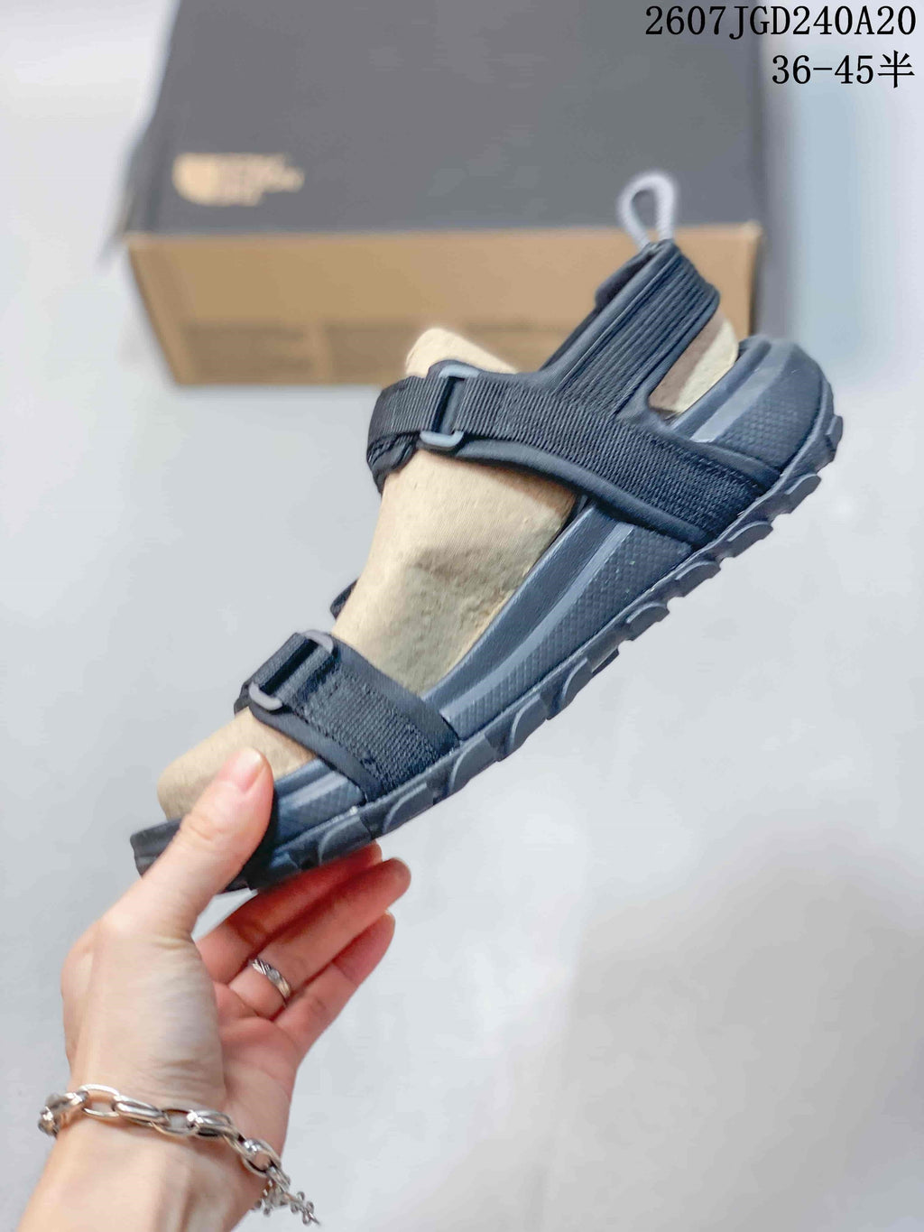 The North Face Explore Camp Sandals in Black and Tan JGD240A20 - product image from the listing.