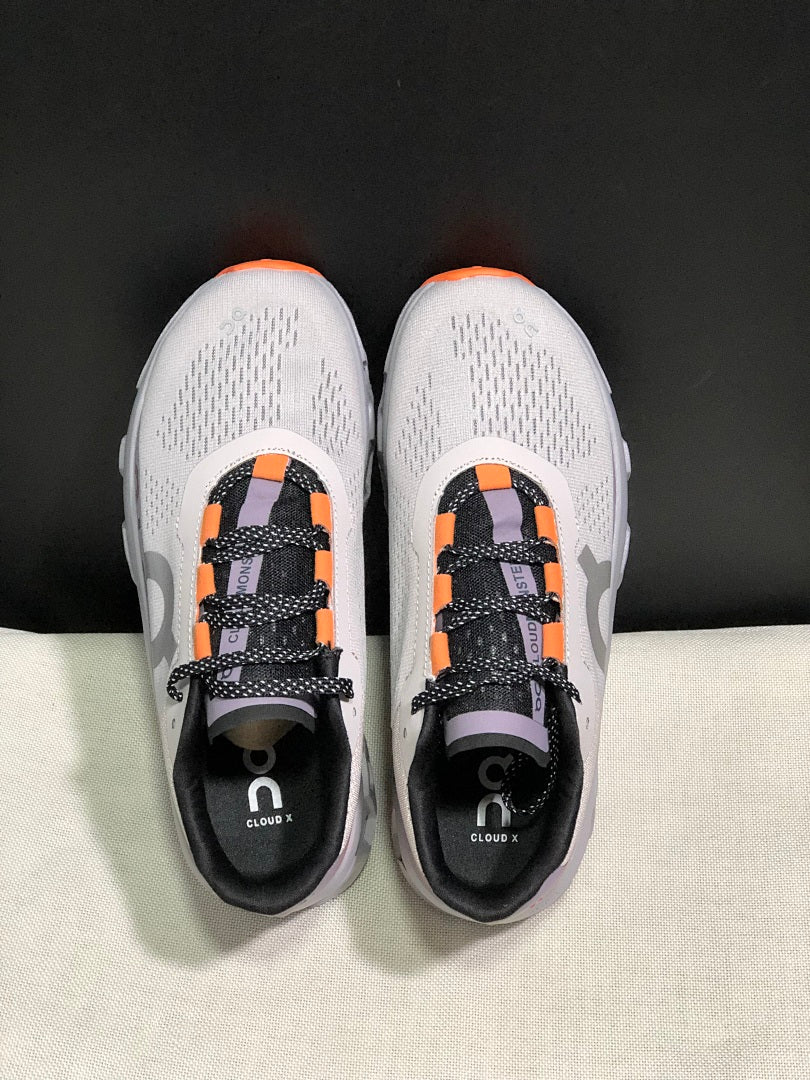 On Cloudmonster Sneakers in Foggy in White and Orange - product image from the listing.
