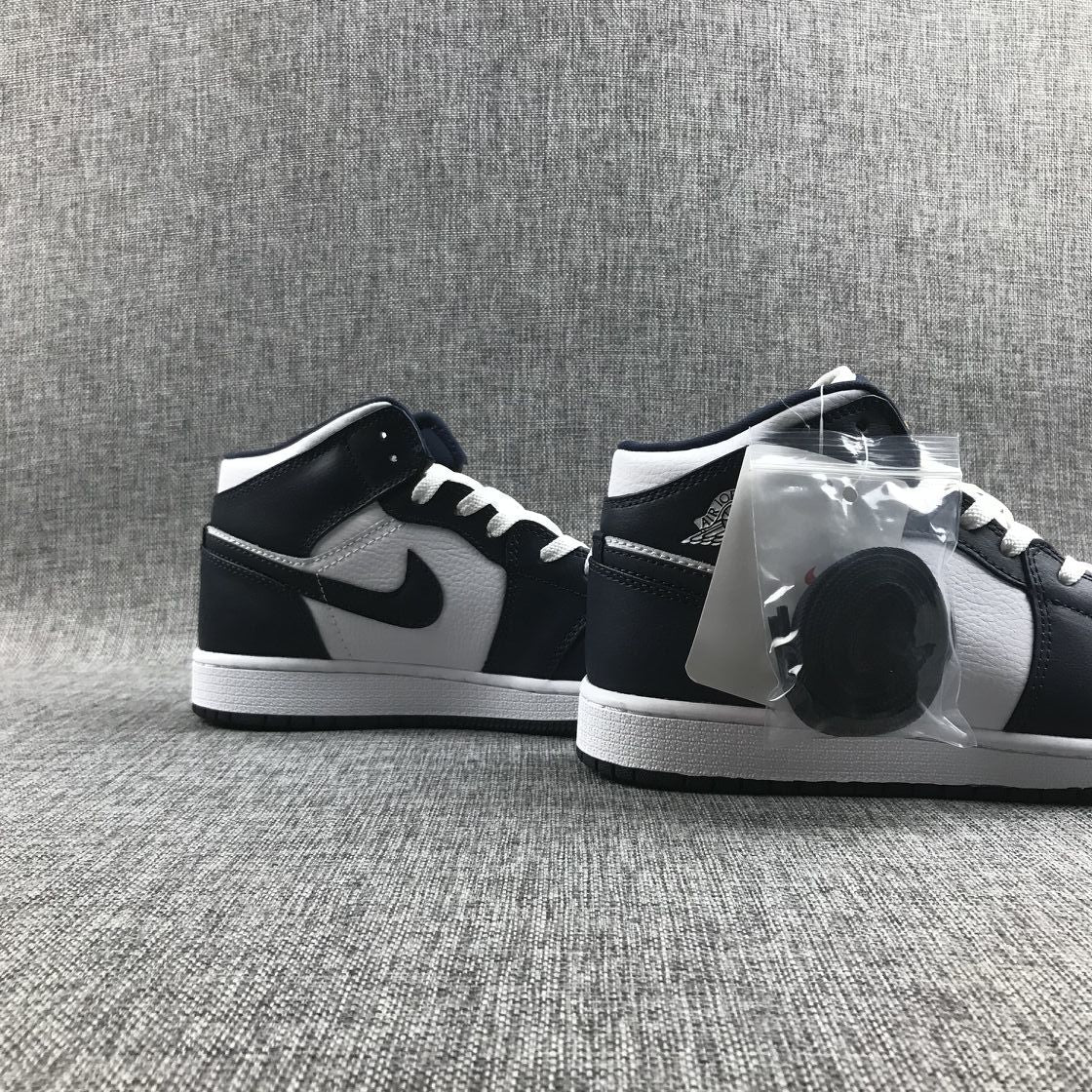 What The Obsidian Sneakers - Jordan 1 Mid 554724-174 - product image from the listing.