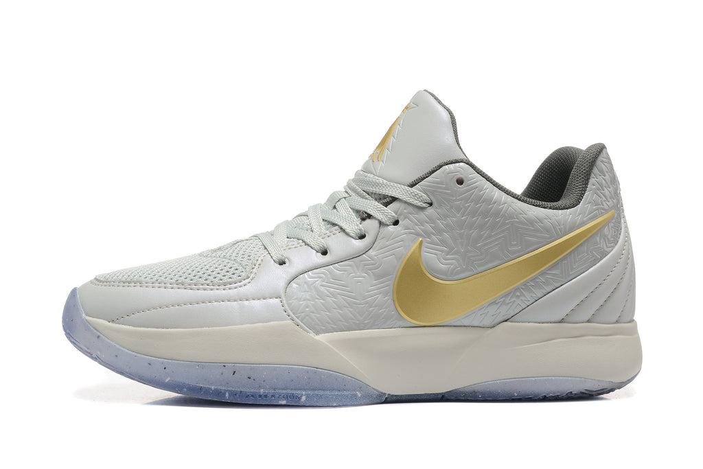 Gray and Gold Nike Kyrie Low Basketball Shoes - product image from the listing.