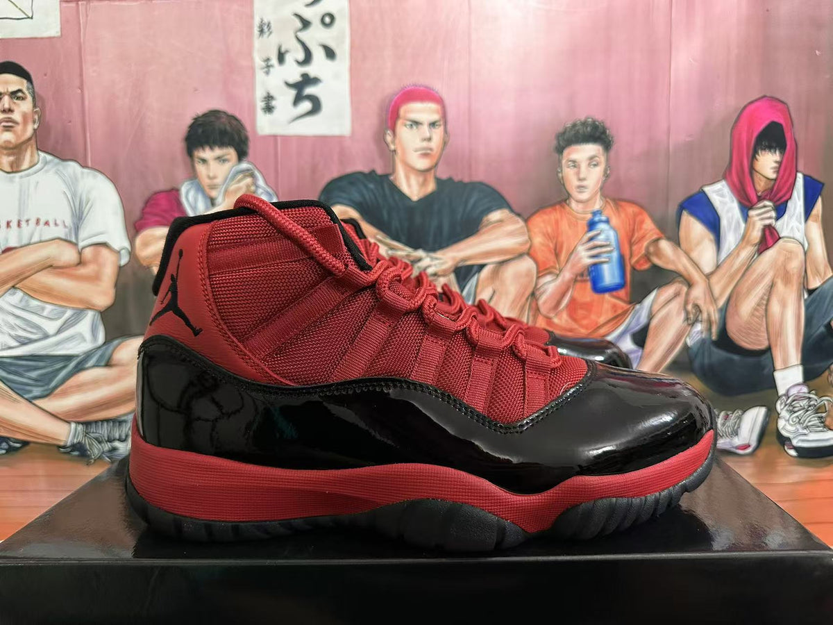 Jordan 11 High-Top Sneakers in Black and Red - product image from the listing.