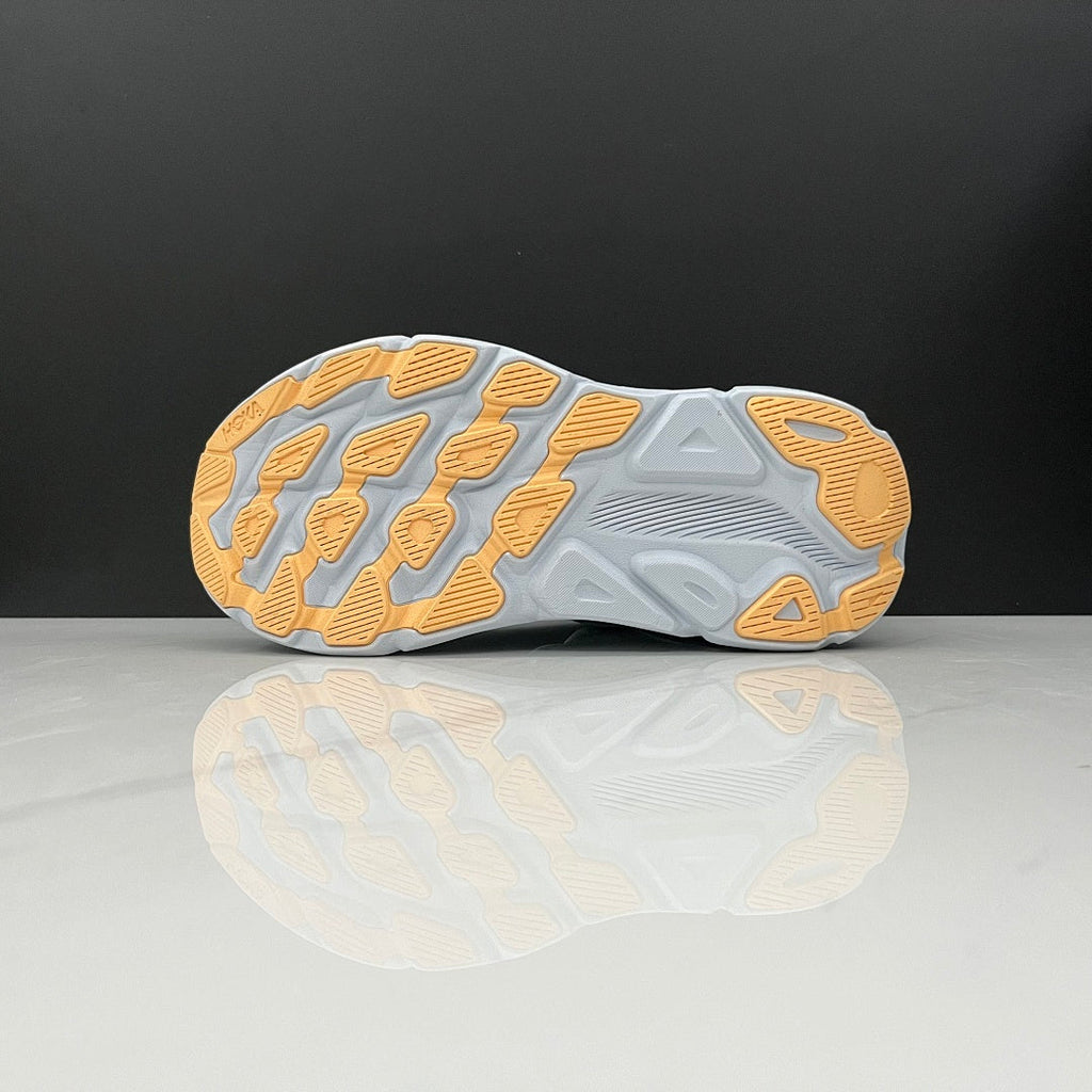 HOKA Clifton 9 Running Shoes in Mint and Yellow - product image from the listing.