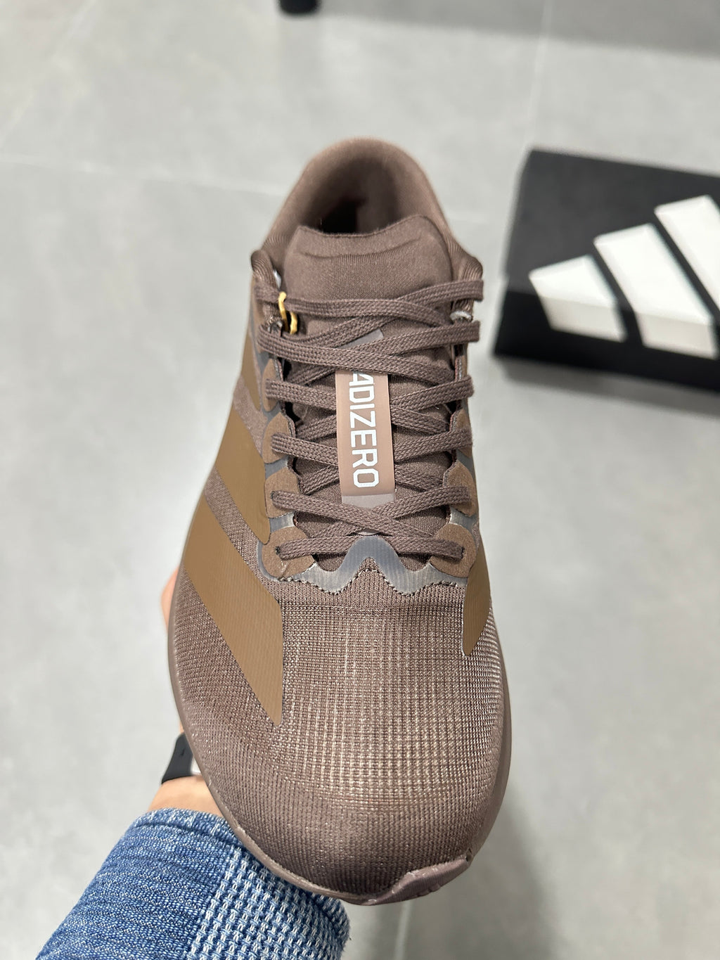 Brown and Tan Adidas Lightstrike Pro Running Shoes - product image from the listing.