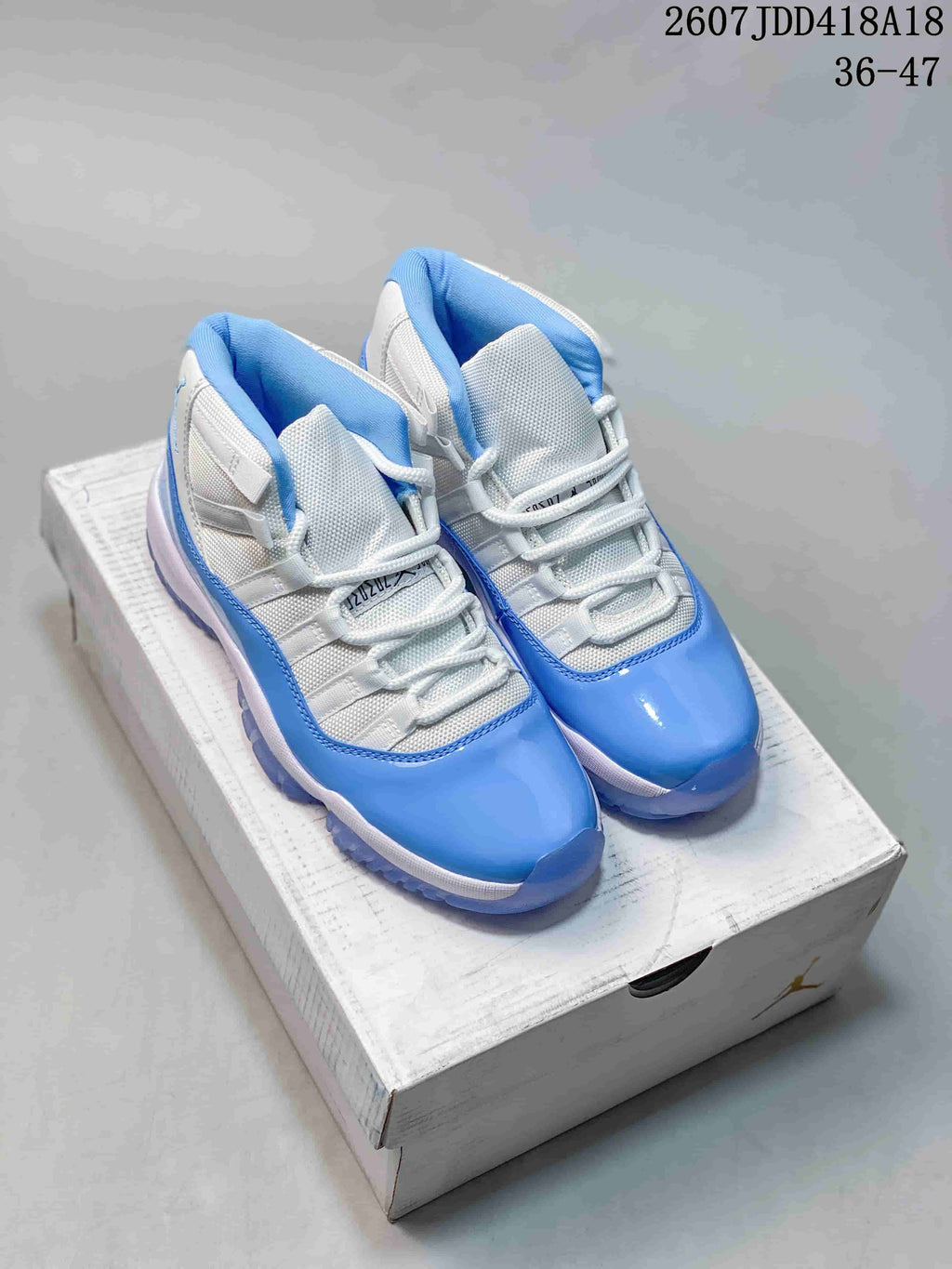 Air Jordan 11 Retro High-Top Sneakers Blue and White - product image from the listing.
