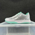 Nike Zoom Sneakers in Silver and Green - product image from the listing.