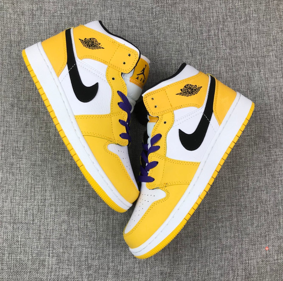 Air Jordan 1 Mid Lakers Sneakers in Yellow and Purple BQ6931-700 - product image from the listing.