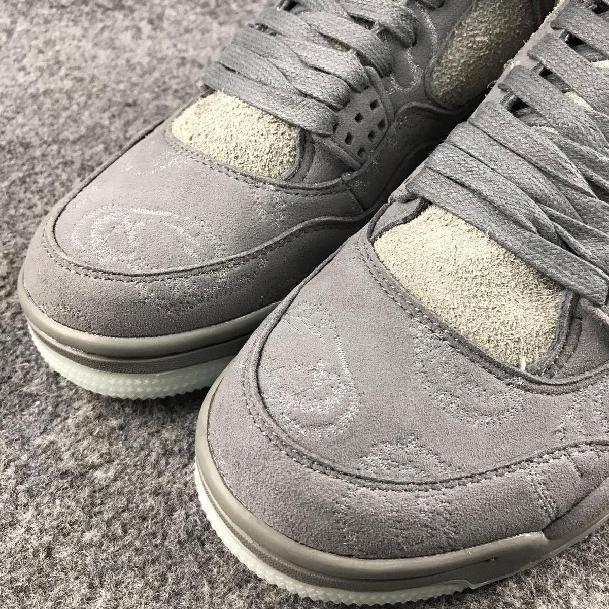 Grey Jordan 4 KAWS Sample High-Top Sneakers - product image from the listing.