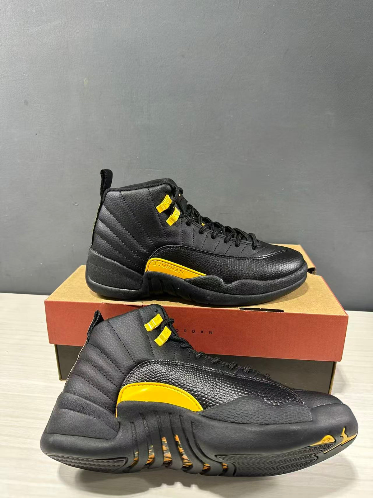 Air Jordan 12 Retro Black Taxi Sneakers CT8013-071 - product image from the listing.