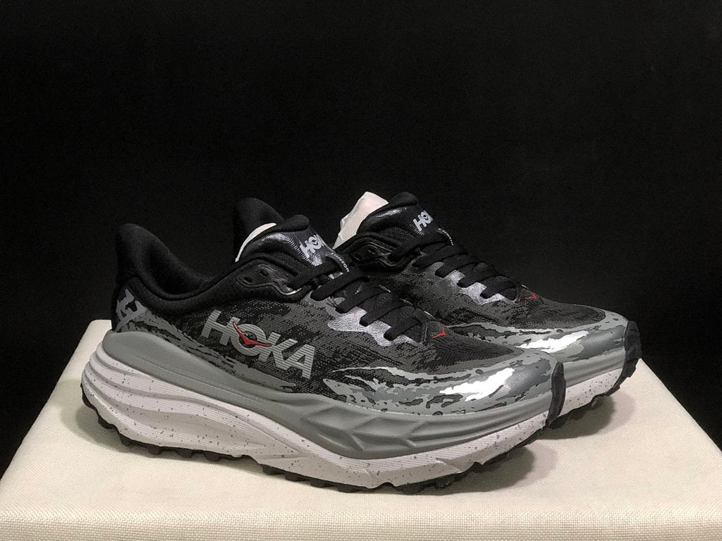 Black and Gray HOKA Stinson 7 Trail Running Shoes - product image from the listing.