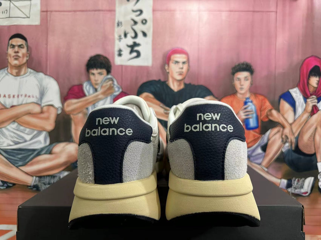 New Balance U370 Sneakers in Off-White and Black - product image from the listing.
