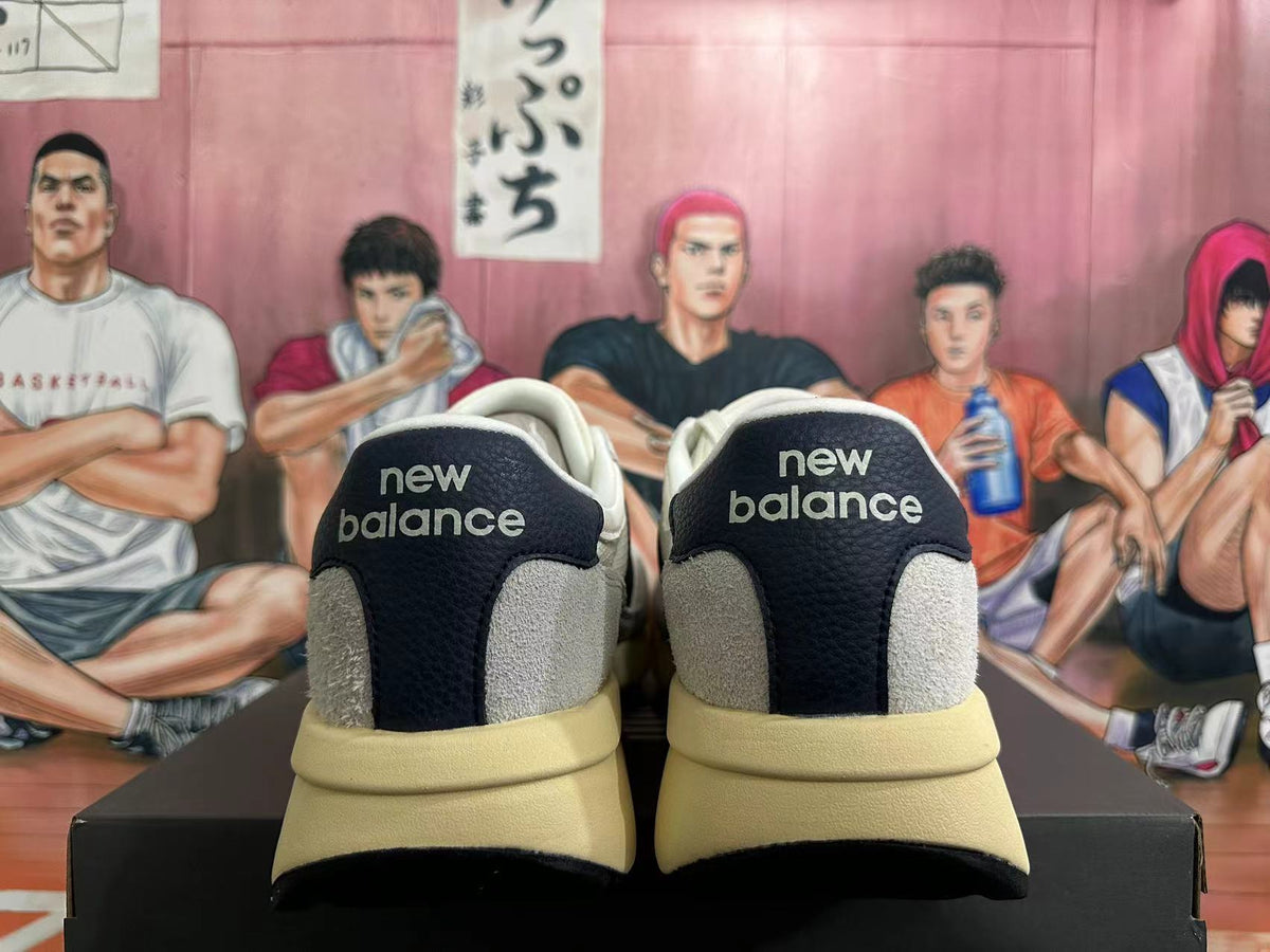 New Balance U370 Sneakers in Off-White and Black - product image from the listing.
