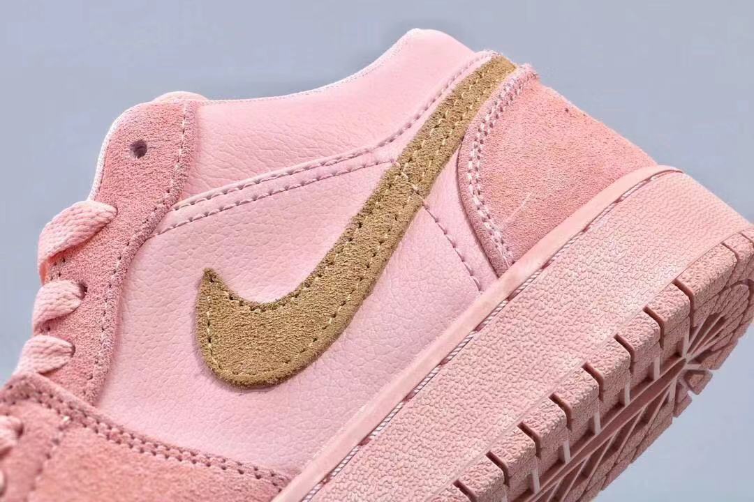 Women's Jordan 1 Low Pink and Gold Sneakers - product image from the listing.