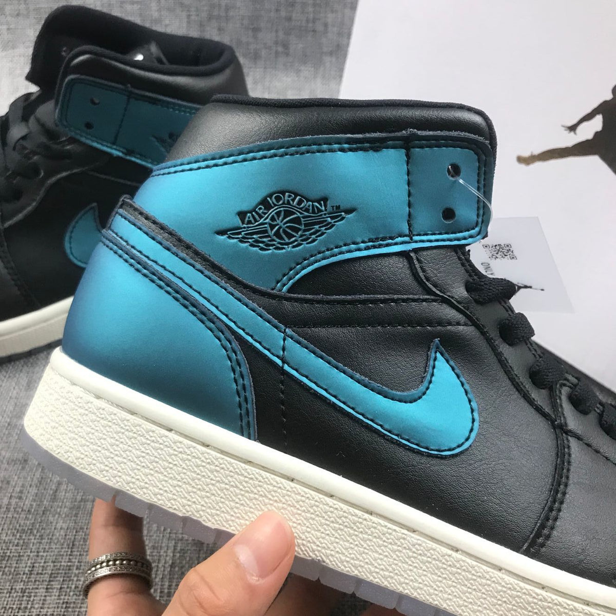 Air Jordan 1 Mid BQ6472-009 Sneakers in Black and Turquoise - product image from the listing.