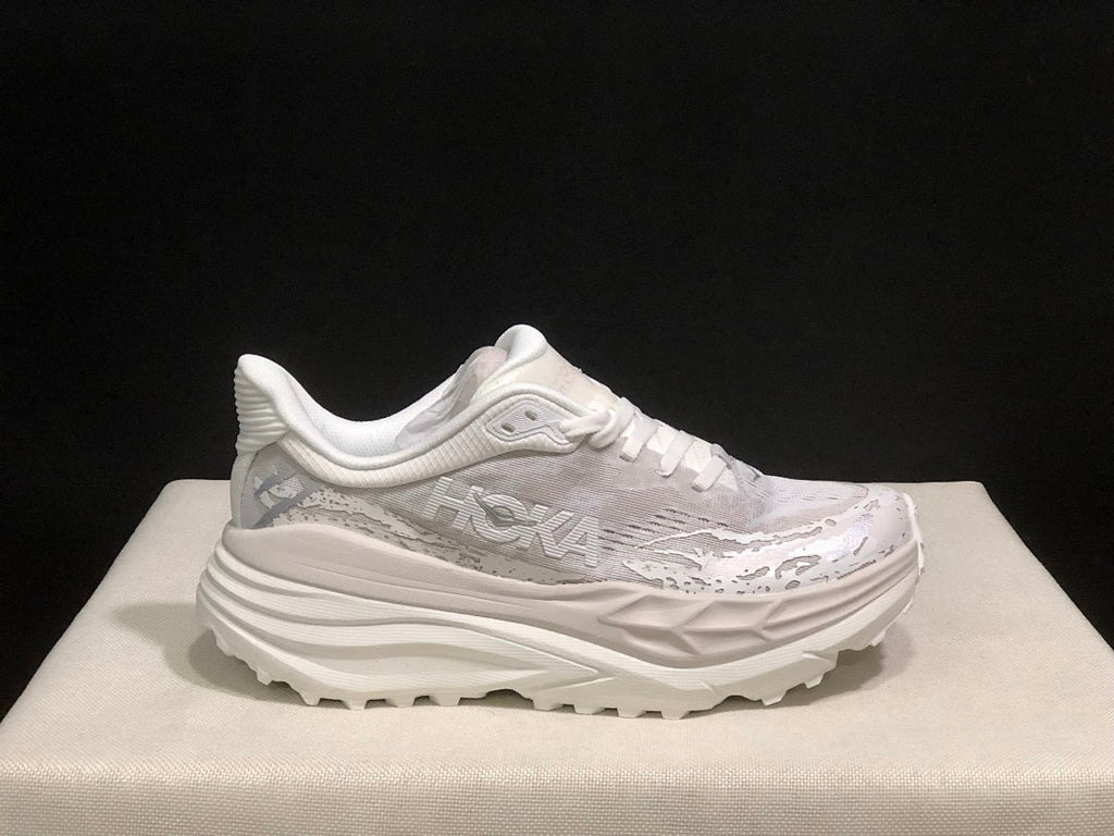 HOKA Stinson 7 Sneakers in White and Gray - product image from the listing.