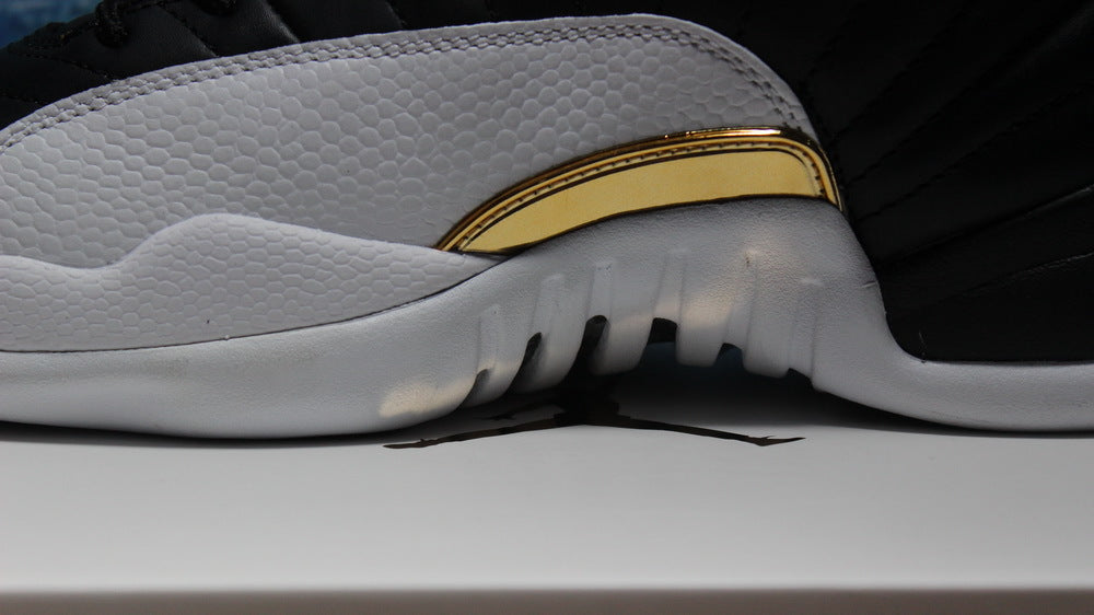 Air Jordan 12 Wings Black White Gold Sneakers 848692-033 - product image from the listing.
