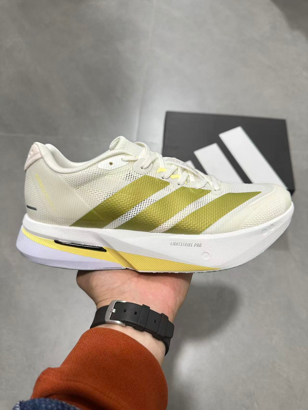 adidas Lightstrike Pro Running Shoes in White Green - product image from the listing.