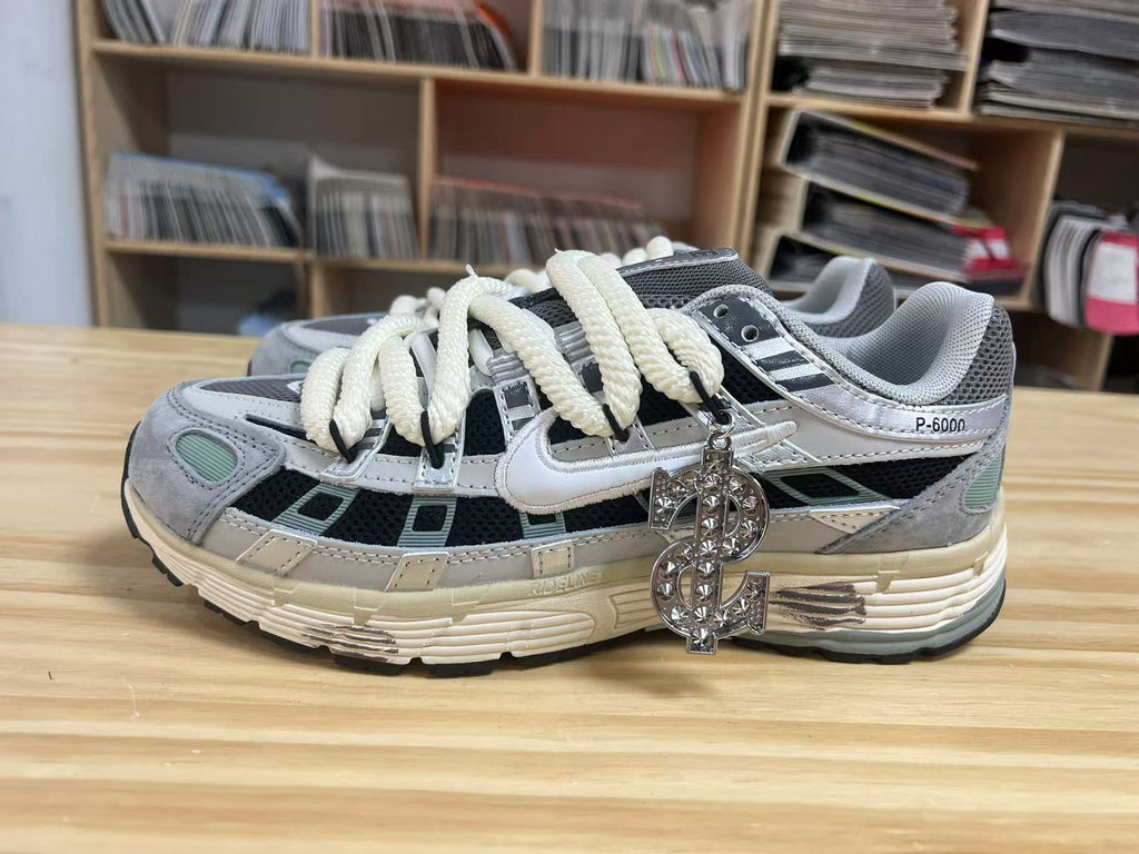 Grey and Black Nike P-6000 Retro Sneakers - product image from the listing.