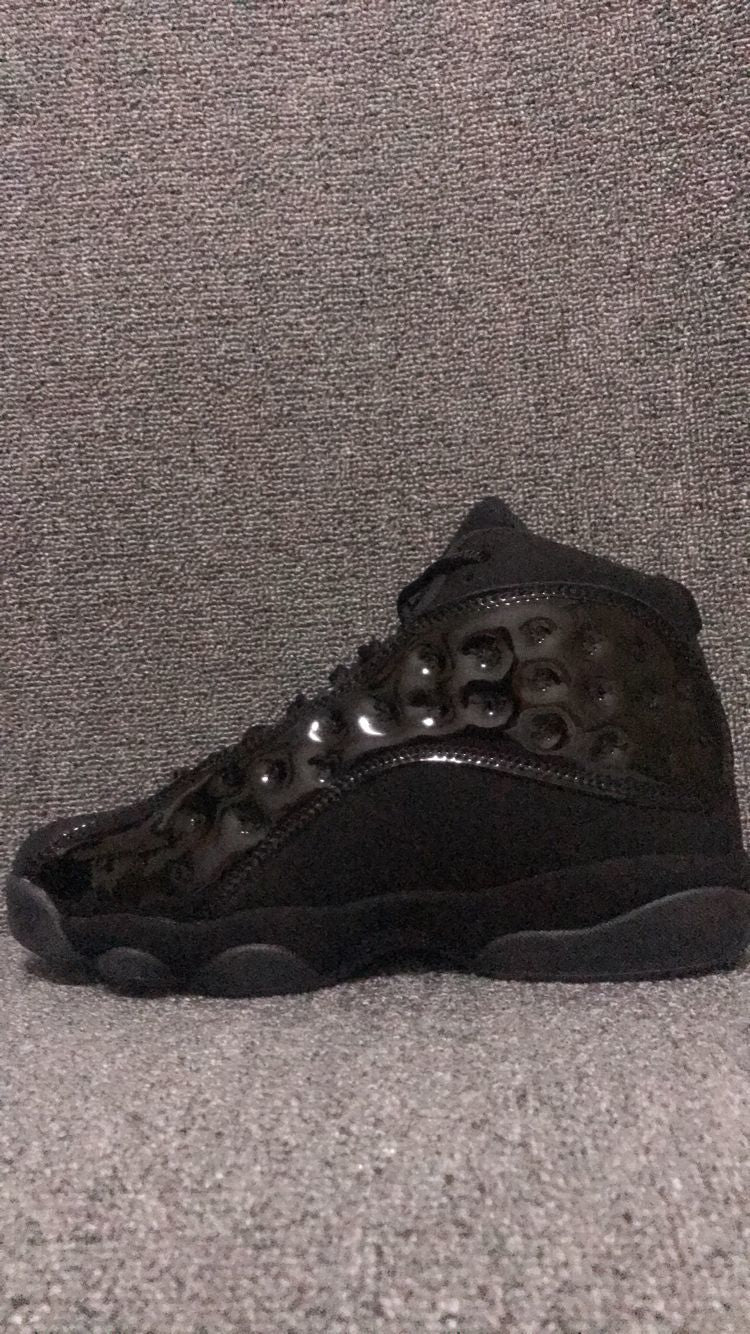 Air Jordan 13 Retro Cap and Gown Sneakers in Black - product image from the listing.