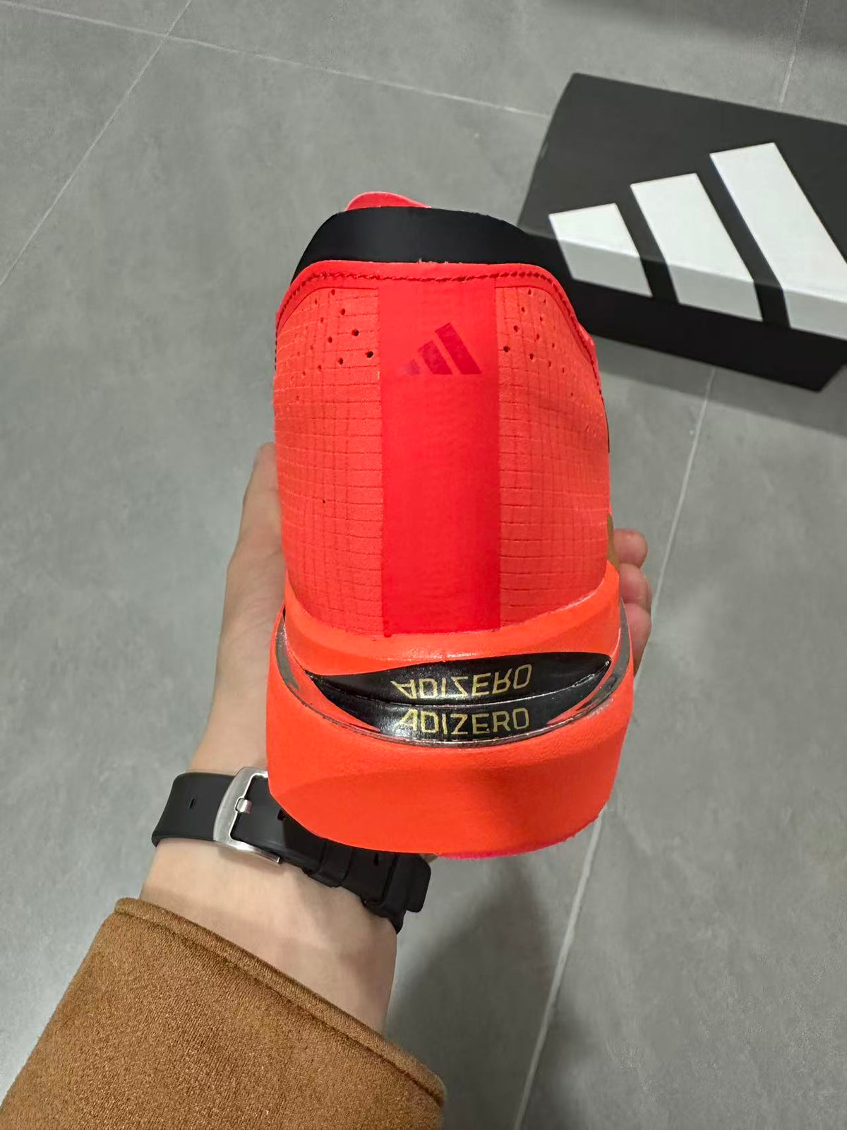 Adidas Adizero Adios Pro 5 Running Shoes, in Red and Lime - product image from the listing.