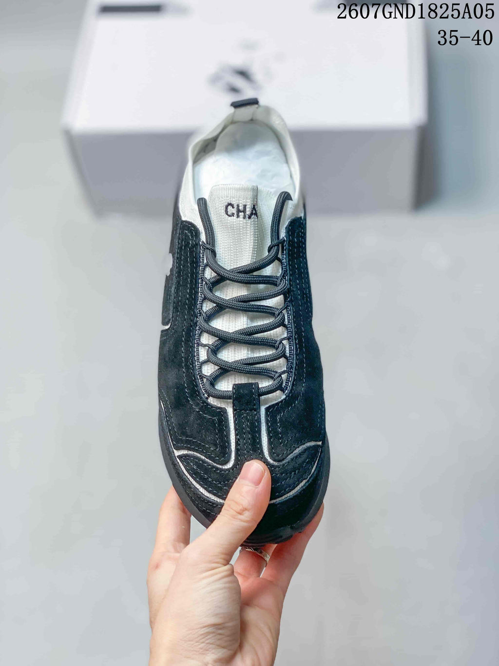Chanel Low-Top Sneakers in Black and White 2607GND1825A05 - product image from the listing.