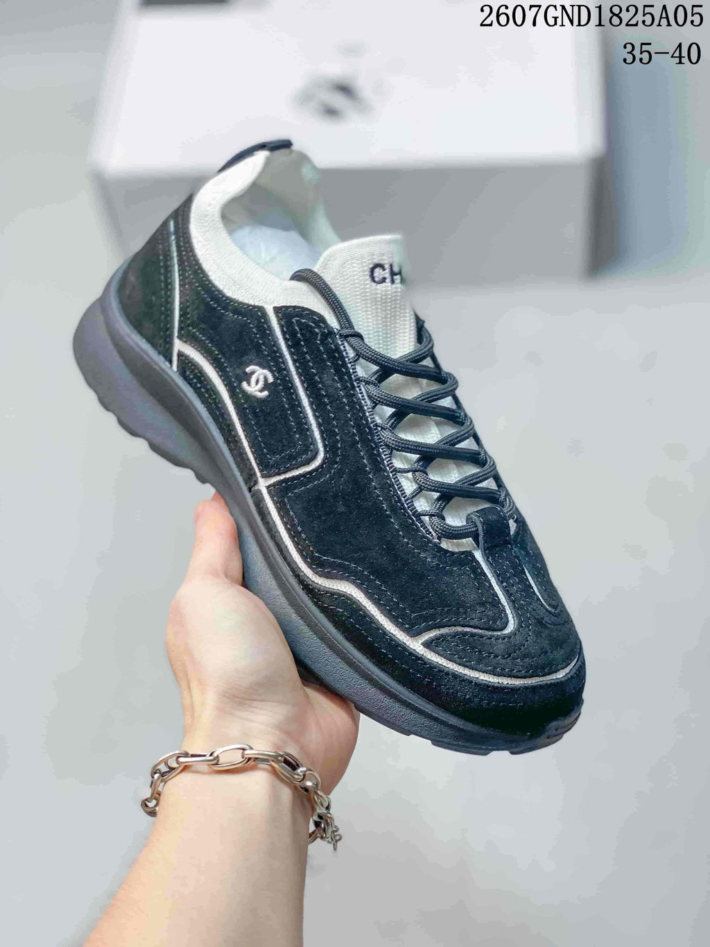 Chanel Low-Top Sneakers in Black and White 2607GND1825A05 - product image from the listing.
