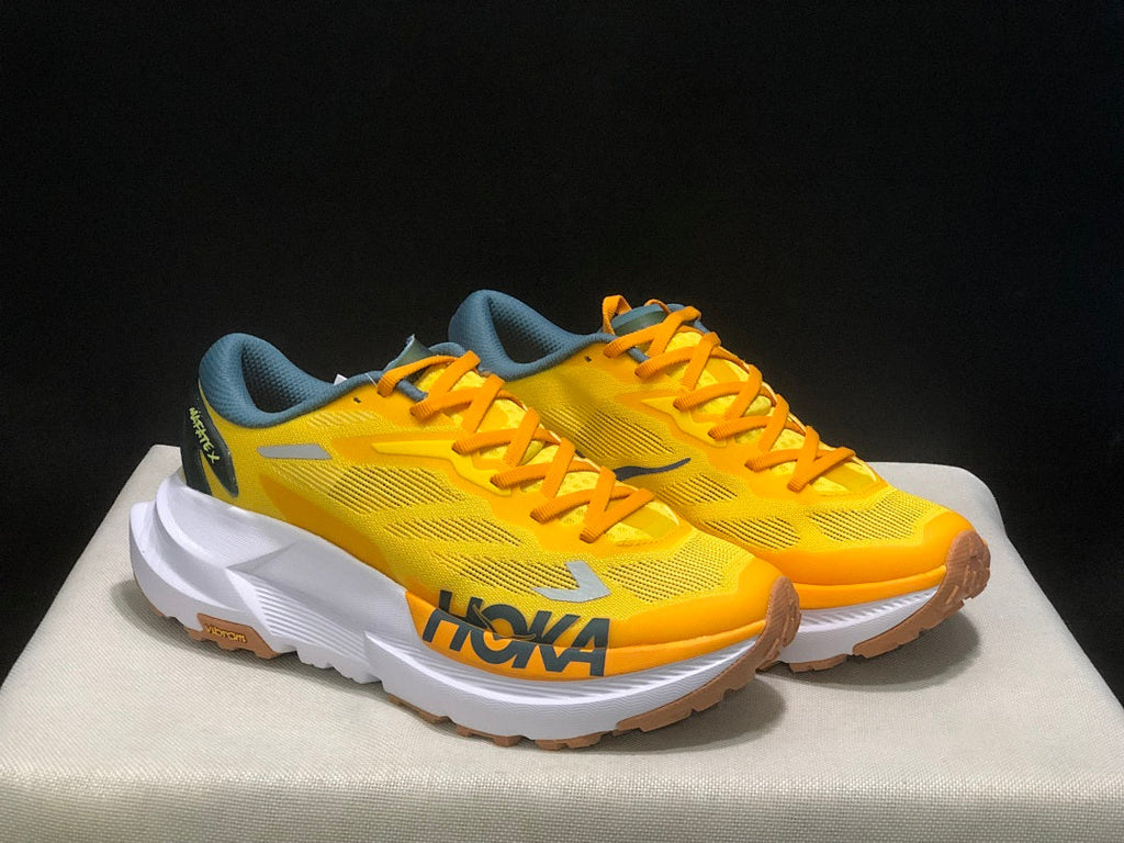 Yellow HOKA Mafate X Trail Running Shoes - product image from the listing.