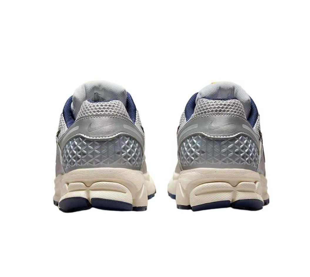 Nike Zoom Vomero 5 Sneakers in Gray Orange - product image from the listing.