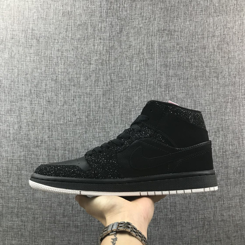 Air Jordan 1 Mid Black and White Sneakers 554724-001 - product image from the listing.
