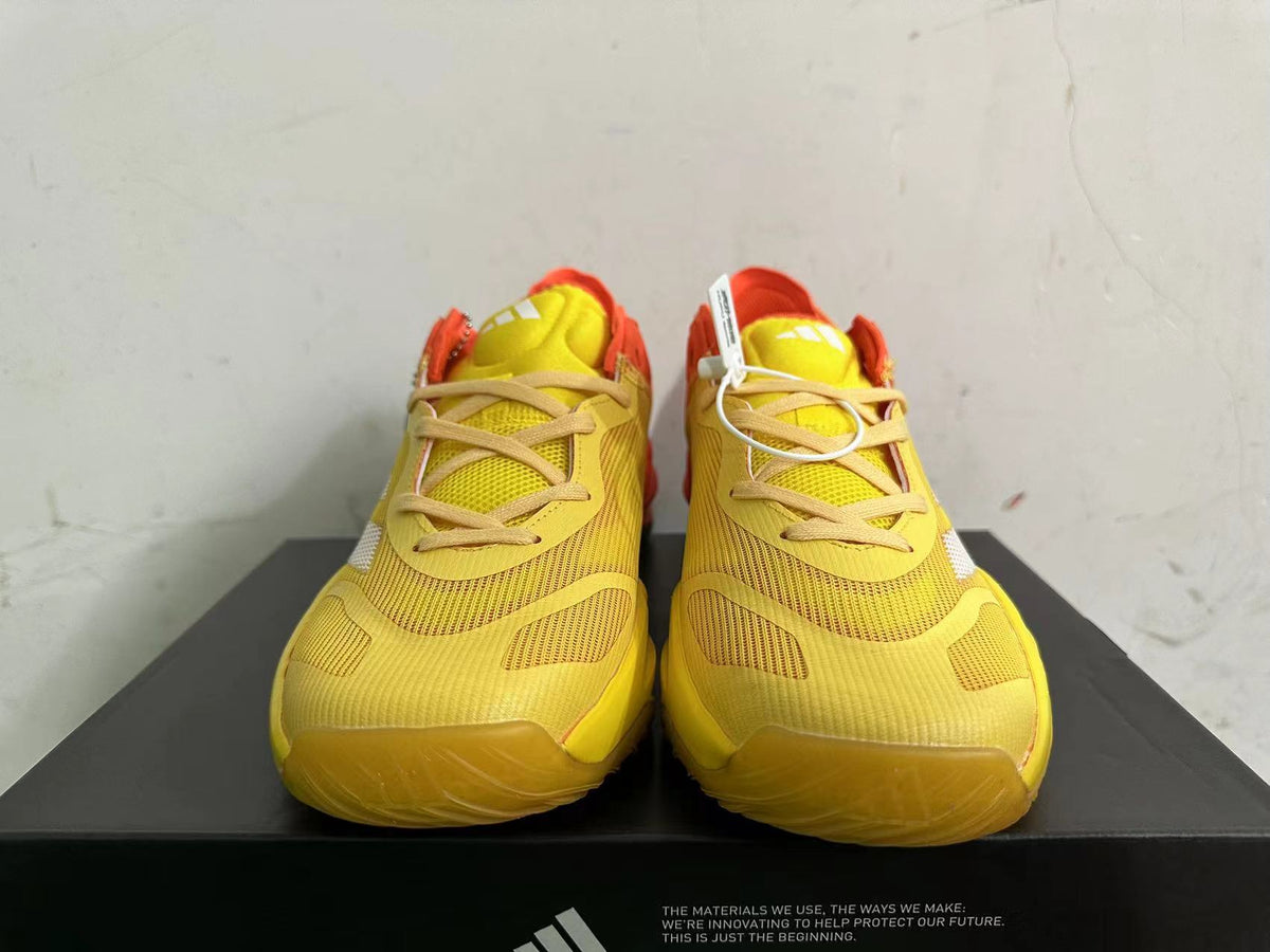 Adidas Adizero Basketball Shoes in Yellow Orange - product image from the listing.