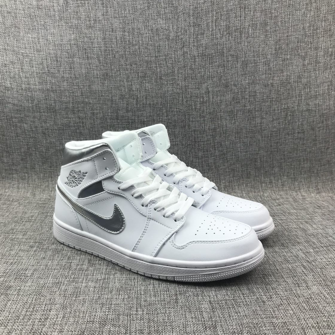 Air Jordan 1 Mid Sneakers in White Silver 554724-105 - product image from the listing.