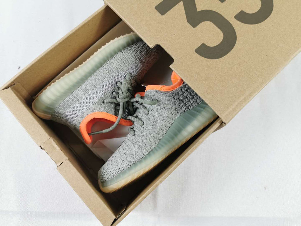 Grey and Orange Yeezy 350 V2 Kids Sneakers - product image from the listing.