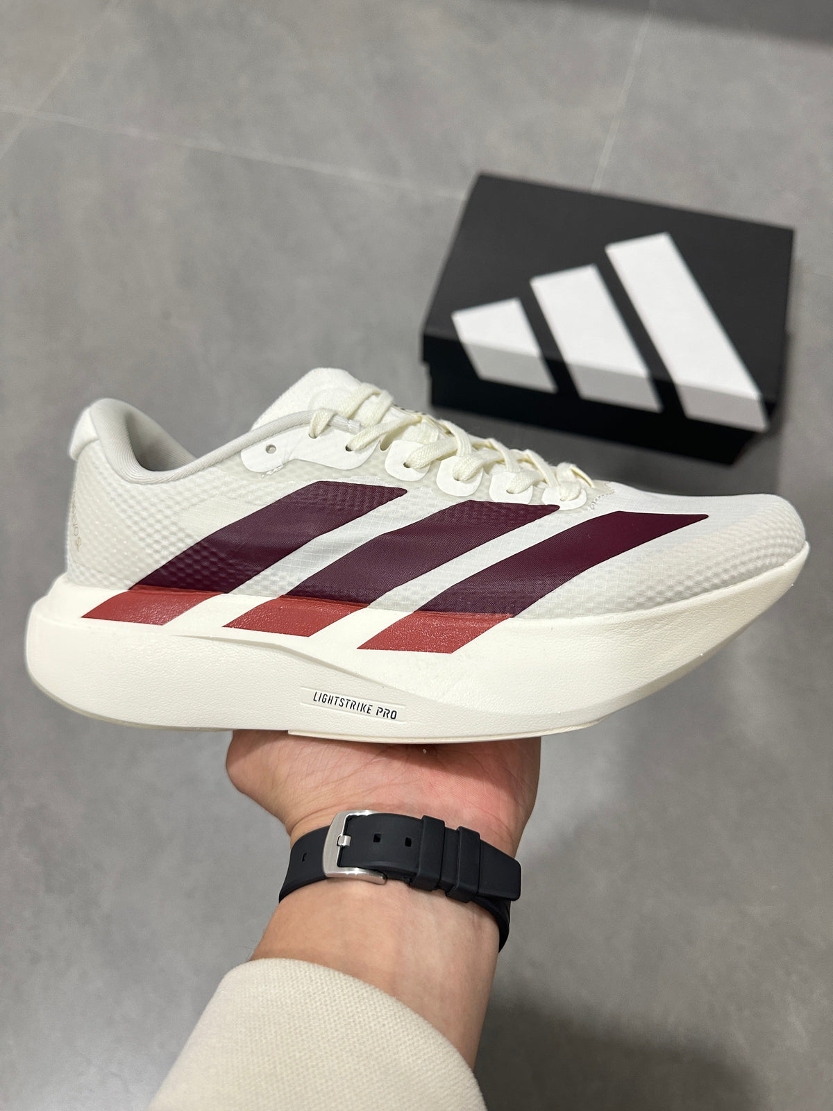 White and Burgundy Adidas Lightstrike Pro Running Shoes - product image from the listing.