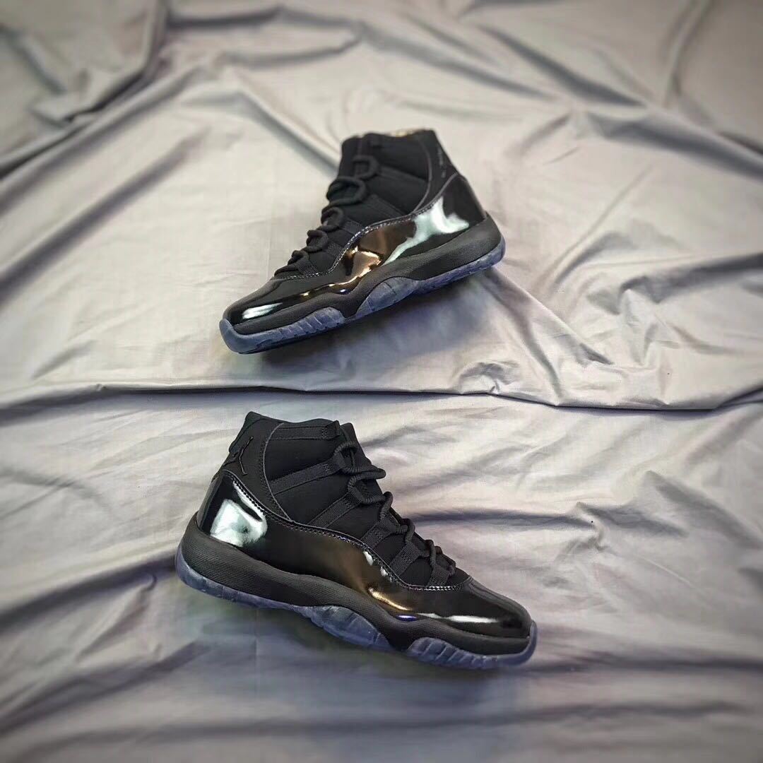 Air Jordan 11 Cap and Gown High-Top Sneakers in Black - product image from the listing.