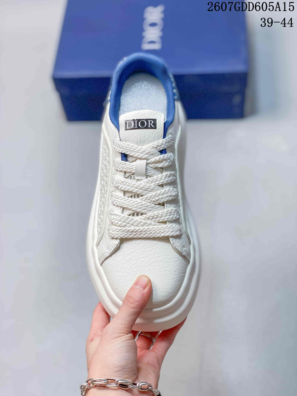 Dior Low-Top Sneakers in White and Blue 2607GDD605A15 - product image from the listing.