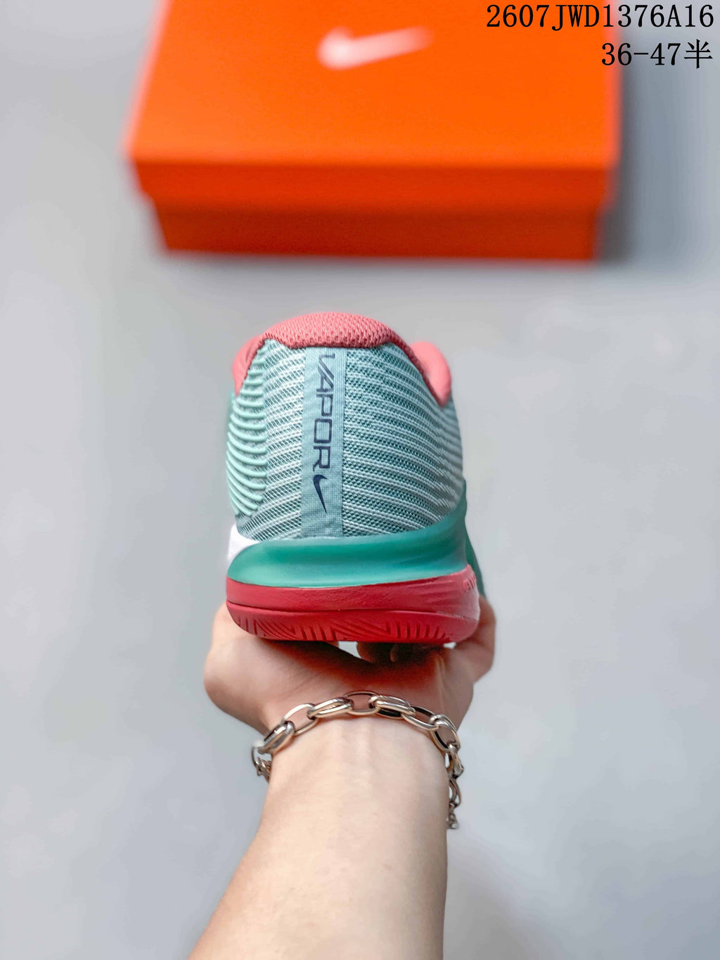 Mint Green and Coral Nike Vapor 12 Low-Top Tennis Sneakers - product image from the listing.