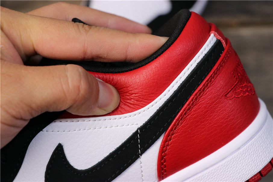 Air Jordan 1 Low Black Toe Sneakers 553558-116 - product image from the listing.