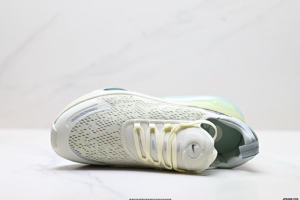 Light Green and White Nike Air Zoom Sneakers - product image from the listing.