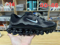 Nike Air Liquid Max Running Shoes in Black and White - product image from the listing.