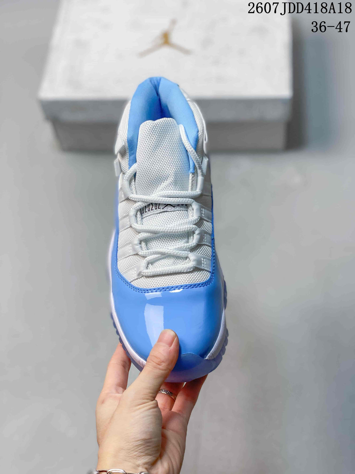Air Jordan 11 Retro High-Top Sneakers Blue and White - product image from the listing.