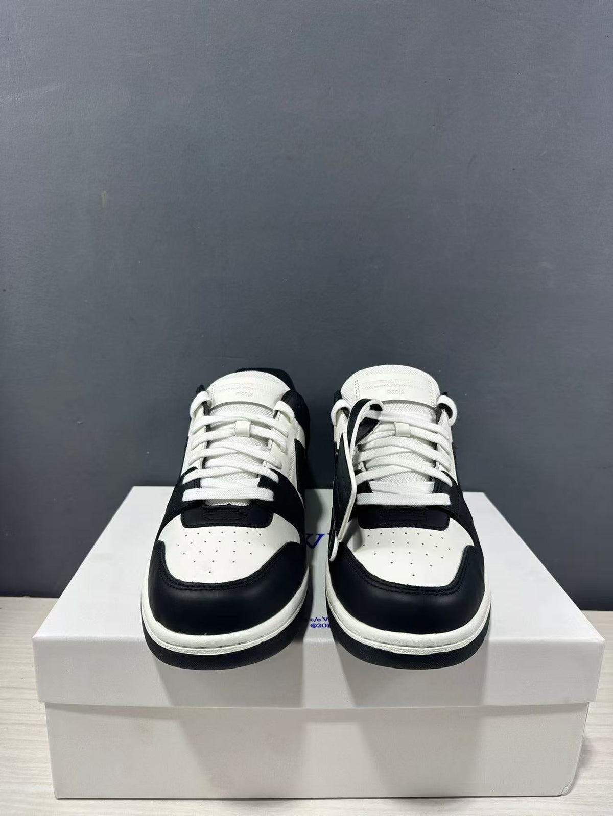 Off-White Out Of Office Low-Top Sneakers in Black White OMAI89C99LEA0070110 - product image from the listing.